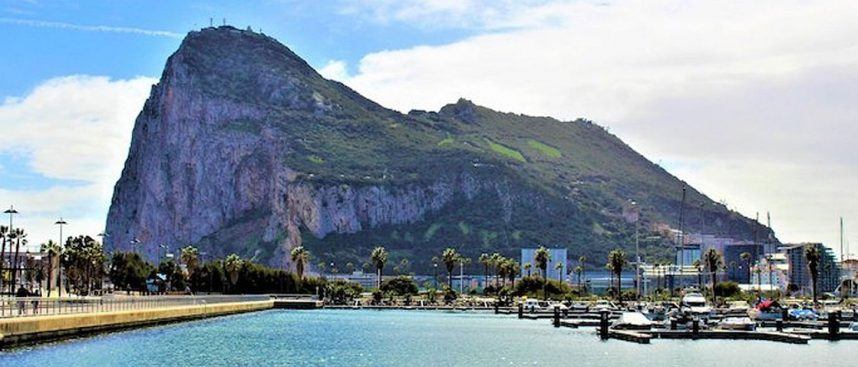 The Rock, better known as Gibraltar, sits in the background of a marina